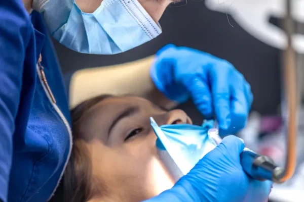 dentist-treats-childs-tooth-using-rubber-dam-closeup-tooth-treatment-1170x694